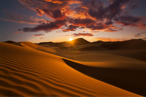 sunset-in-Merzouga Sahara Camel Tours
