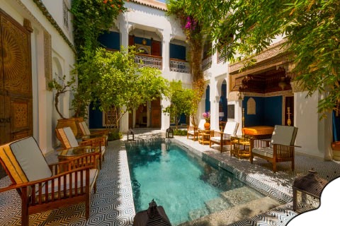 Luxury Riads in Marrakech Medina swimming pool surrounded by Moroccan-style architecture