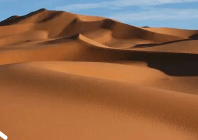 Camel trek across the golden dunes of Merzouga in the Sahara Desert on a 7-day Morocco tour itinerary