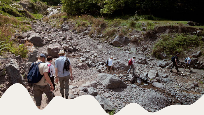 Hikers walking along a scenic trail in the Atlas Mountains.