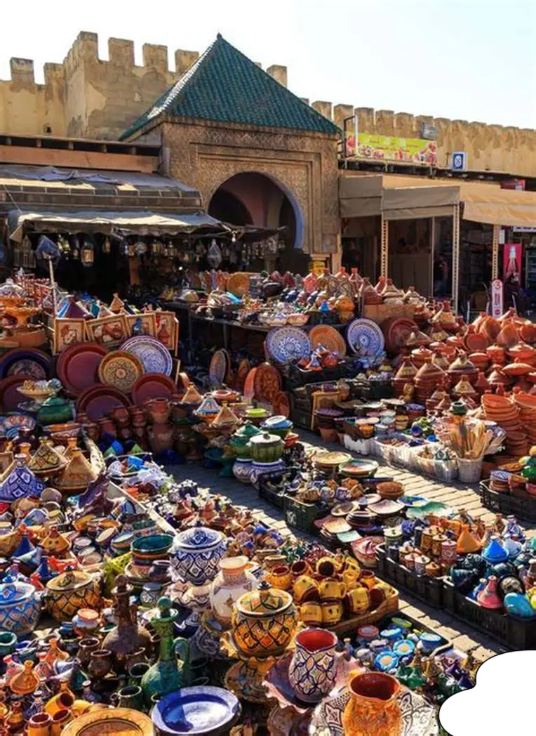 Colorful Moroccan ceramics in a souk for Moroccan Souks Shopping Guide.