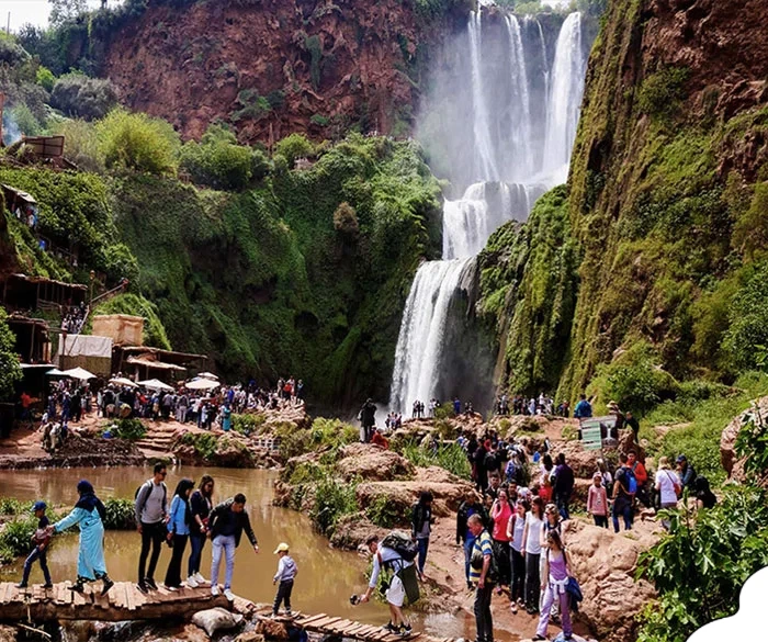 Boat ride at the base of Ouzoud waterfalls during a day trip.